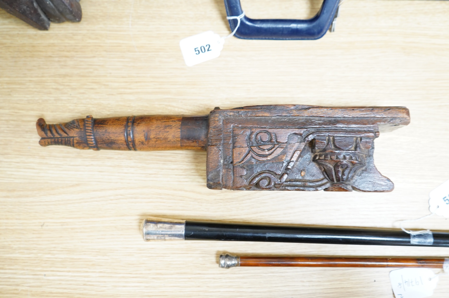 An 18th / 19th century Indian carved wood oil pourer, 43cm